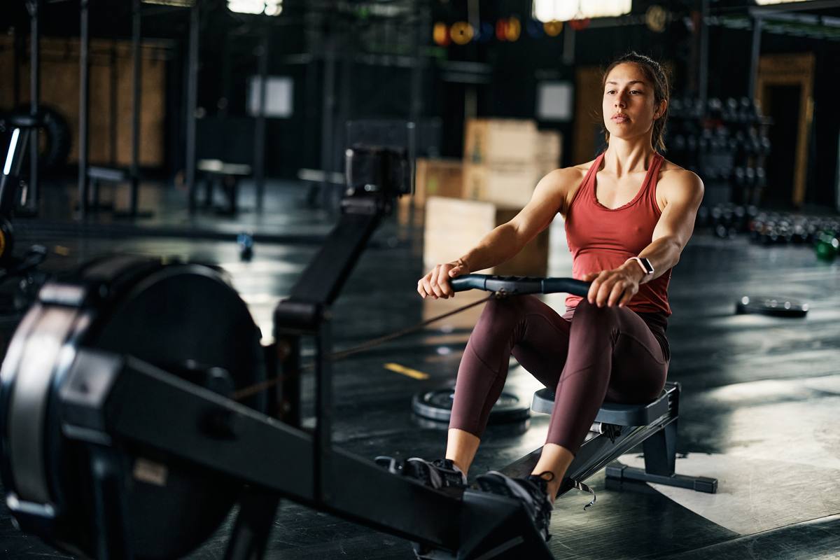 Athletes racing together as a team at an indoor rowing event